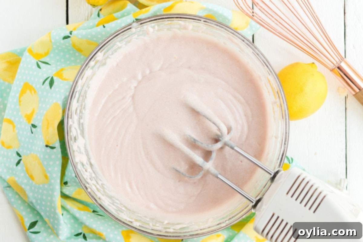 Sparkling Pink Lemonade Cake 9 pink cake batter in a bowl