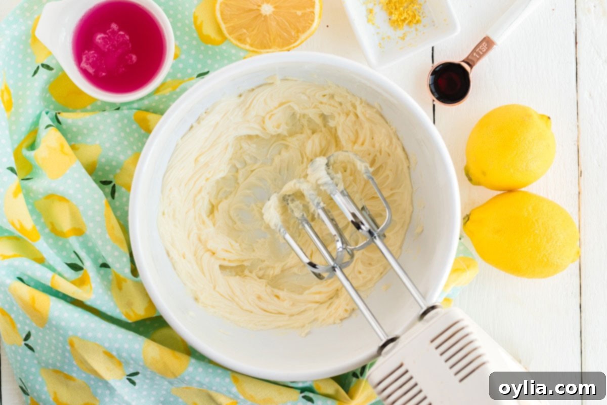 Sparkling Pink Lemonade Cake 10 beating butter in a bowl with a mixer
