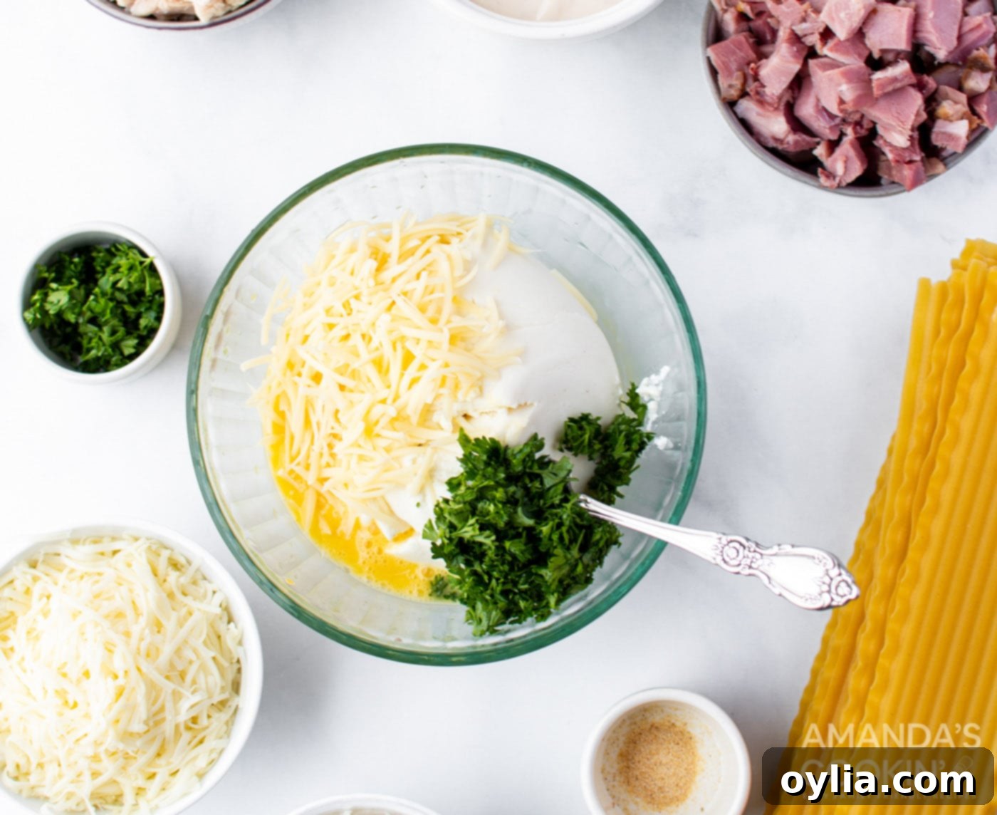 Mixing ricotta cheese, eggs, Parmesan, and parsley in a bowl for the lasagna filling.
