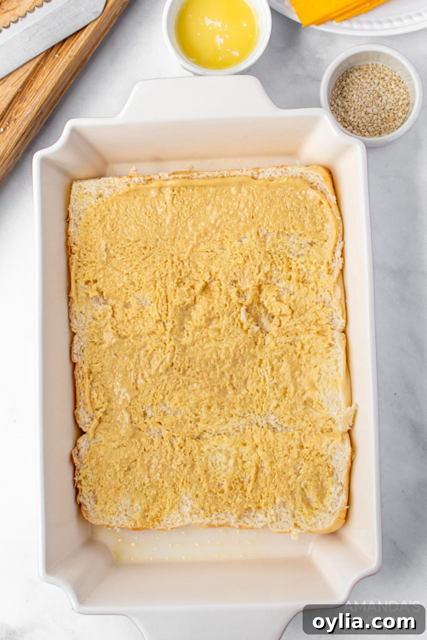 Step 3: Spreading mustard mixture on rolls