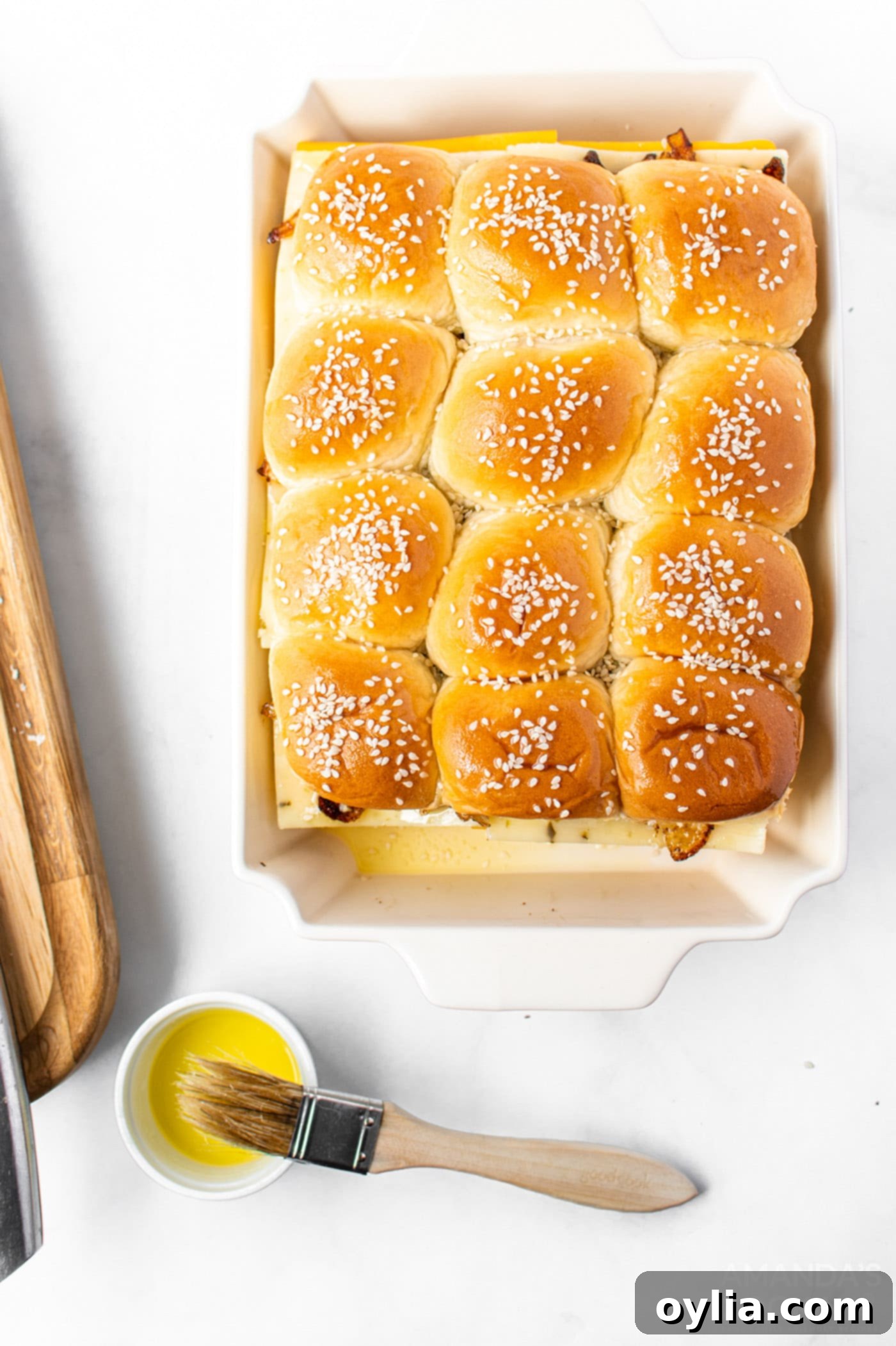 Step 6: Topping sliders with butter and sesame seeds