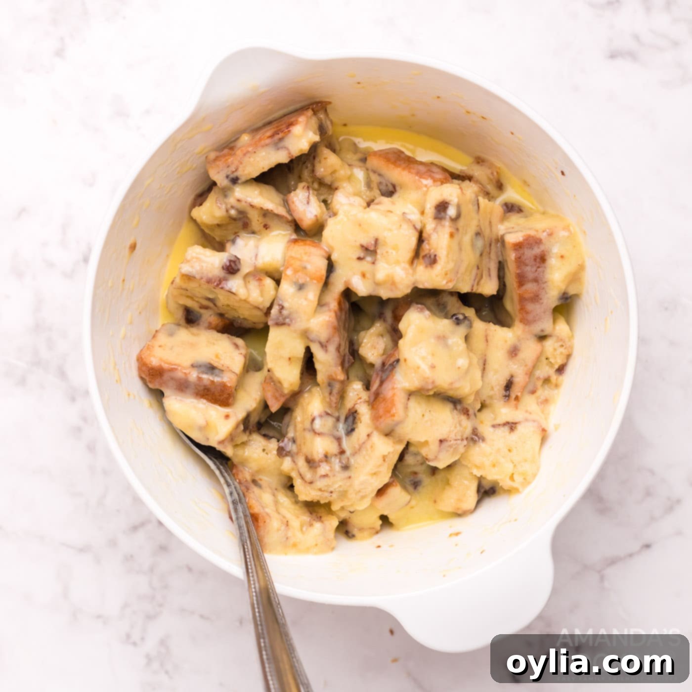 bread squares in a bowl of egg mixture