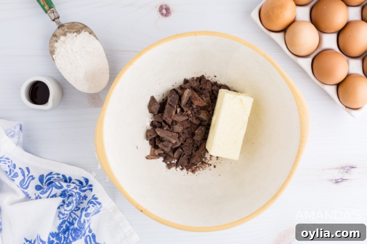 Melting butter and unsweetened chocolate in a bowl for brownies
