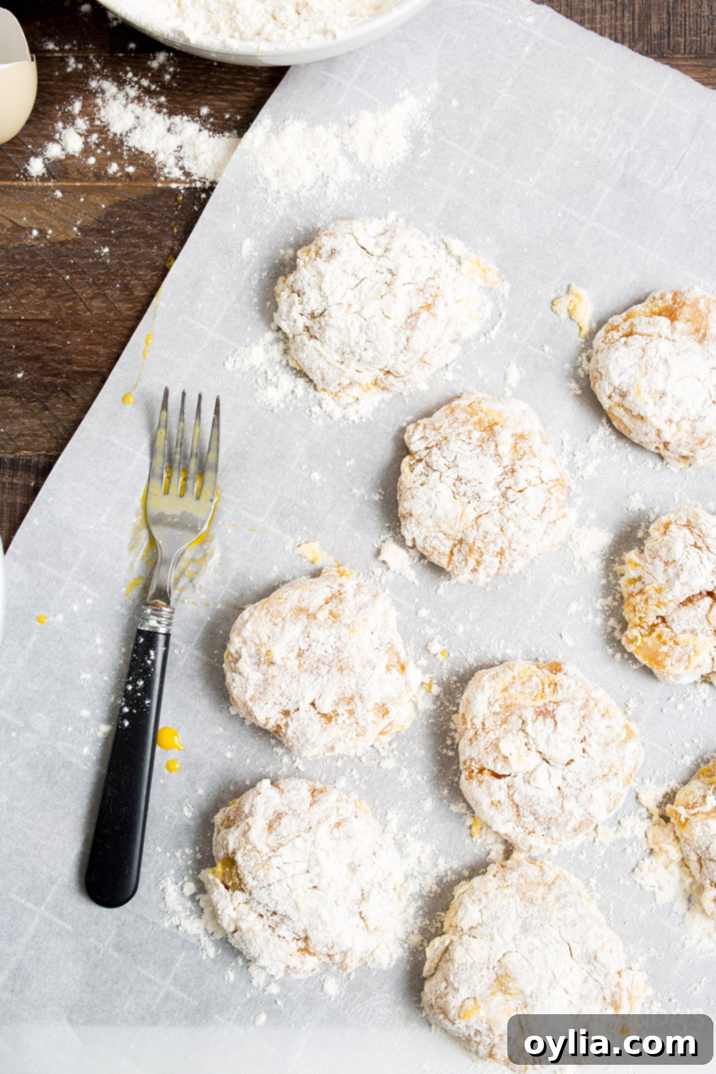 four coated chicken nuggets on parchment