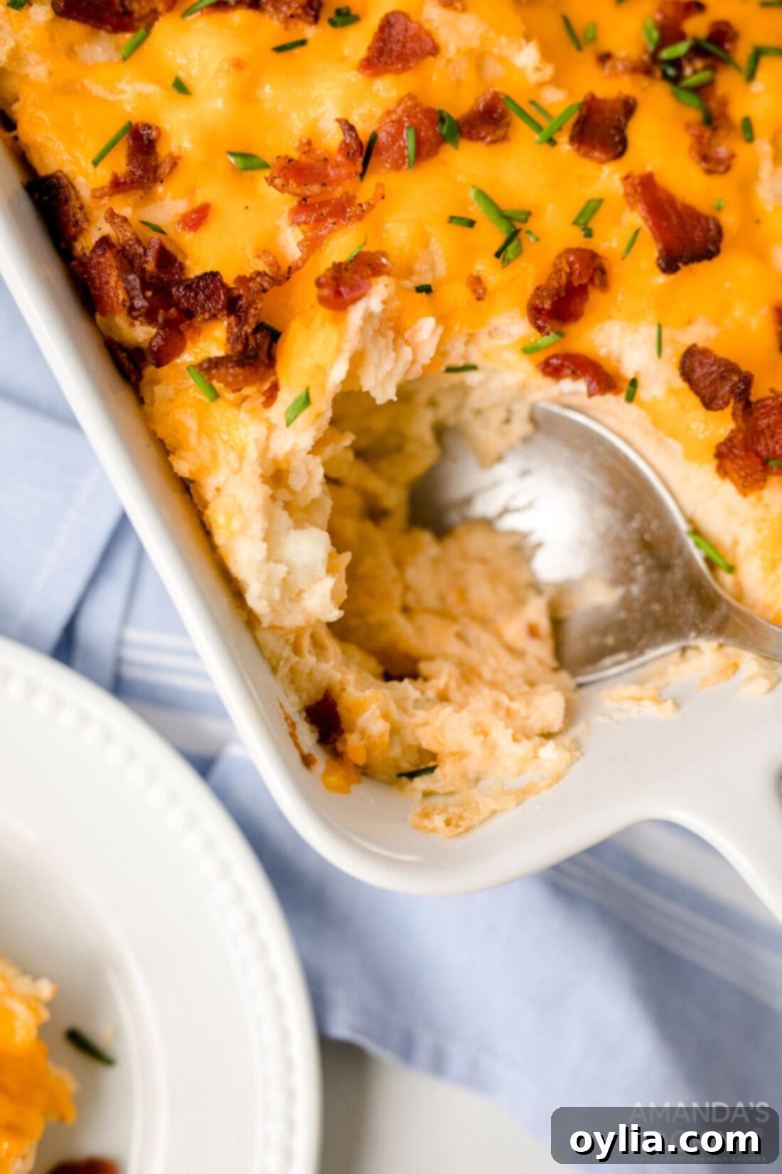 spooning out potato casserole