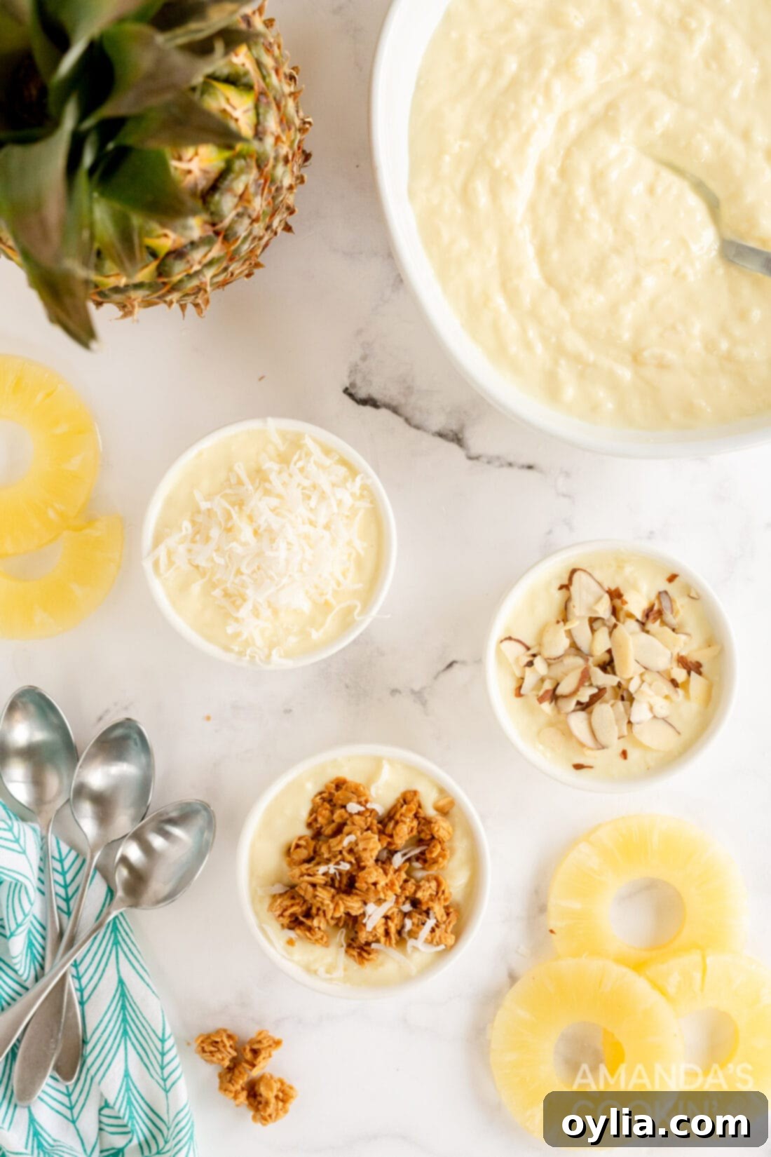 Tropical Yogurt Delight 8 overhead photo of pineapple yogurt dessert in a large serving bowl, with a spoon