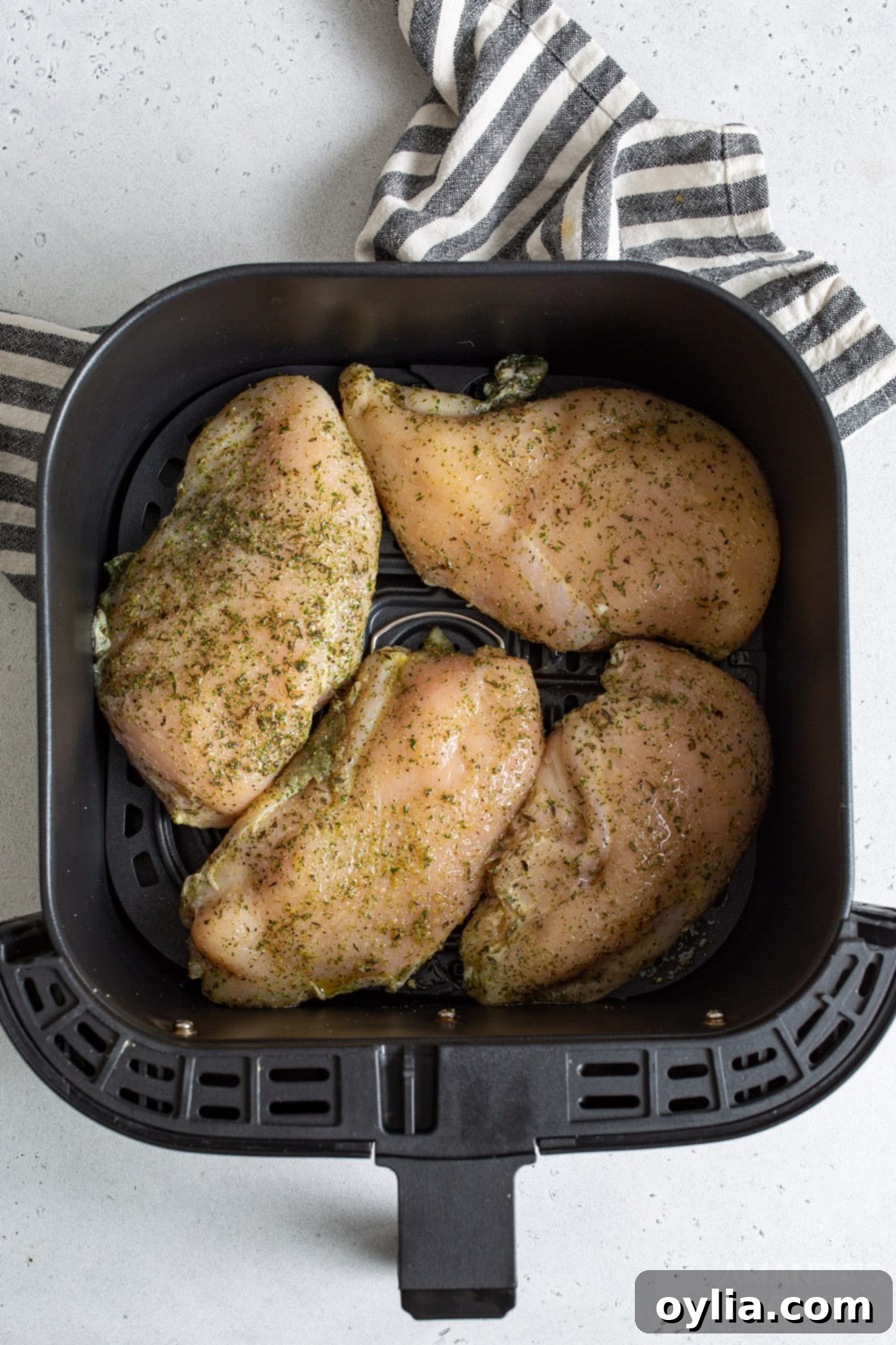 raw chicken in air fryer basket