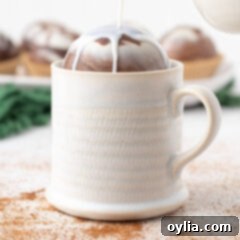 pouring milk over a hot cocoa bomb