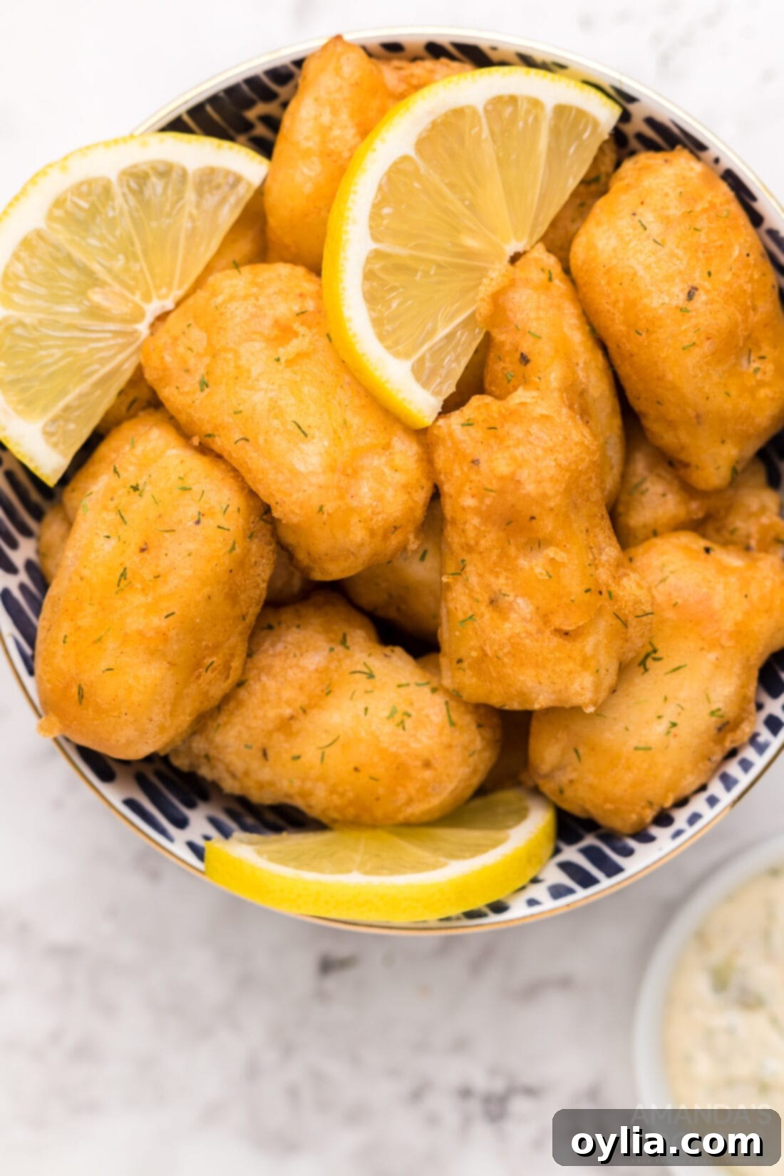 Bowl of freshly fried beer battered fish nuggets