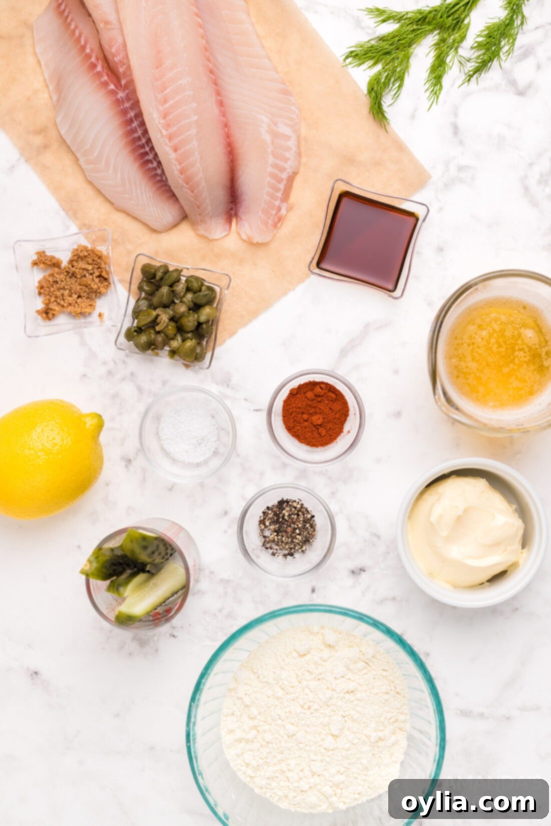All ingredients laid out for Beer Battered Fish, including fresh fish, beer, flour, and seasonings.