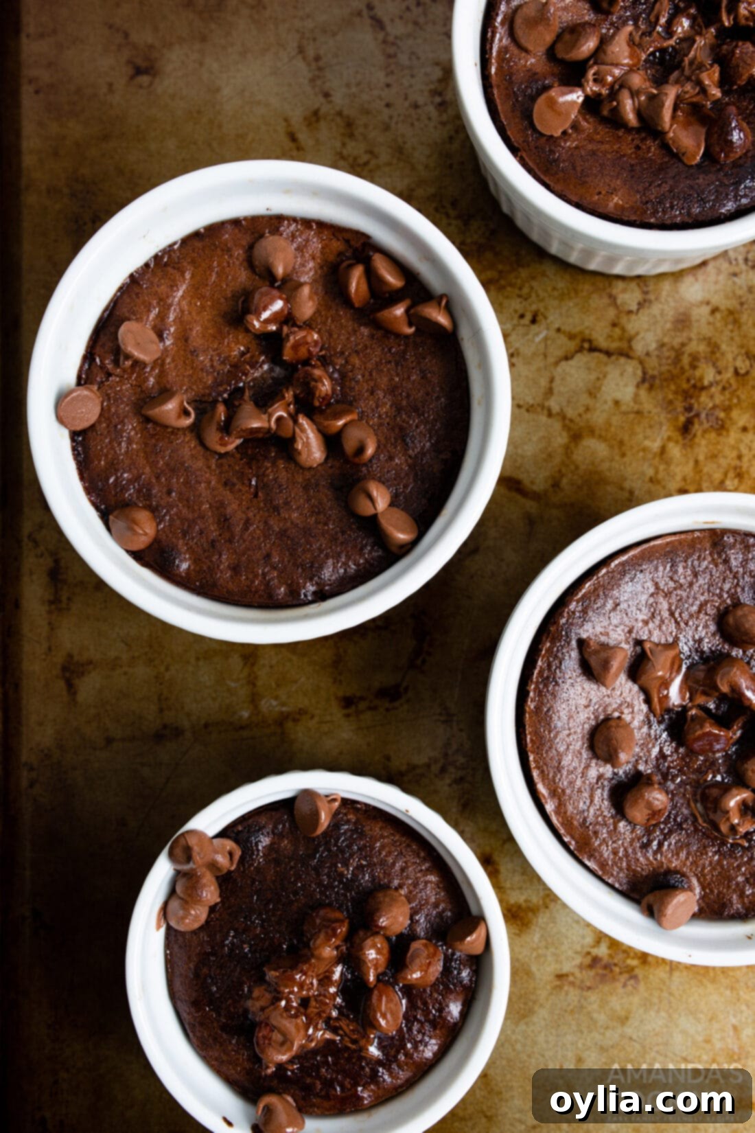 air fryer brownies in ramekins on a baking sheet