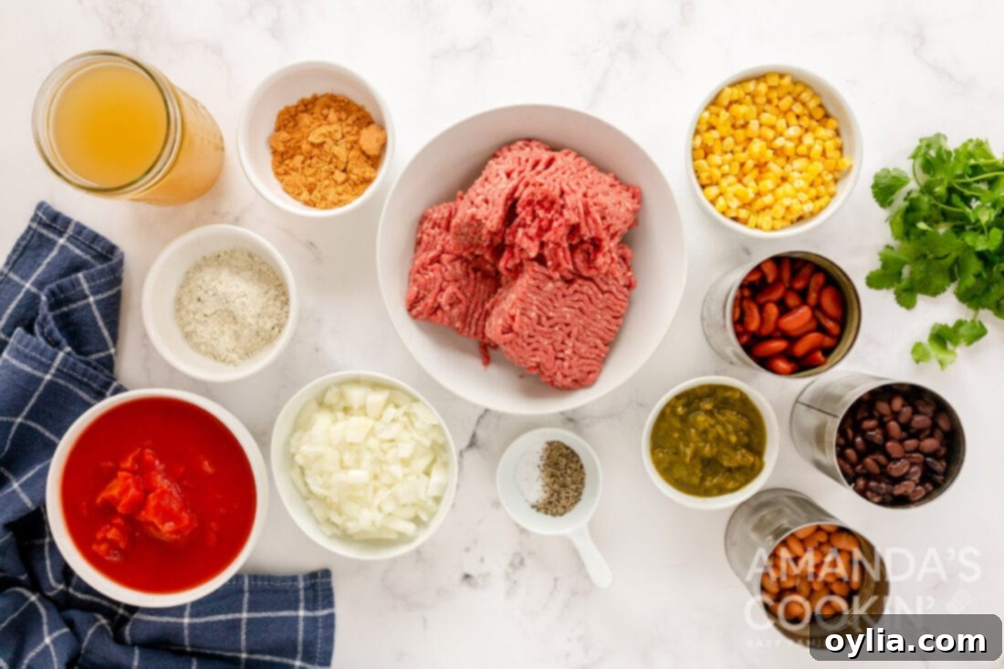 Ultimate Taco Soup 4 All the fresh and canned ingredients laid out on a kitchen counter, ready for making taco soup.