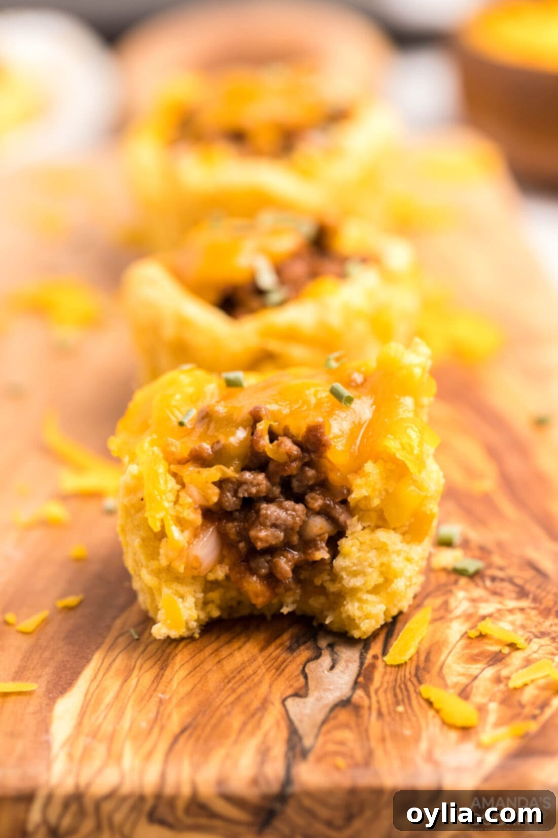 Sloppy Joe Corn Muffin with a bite taken out, showing the delicious filling.