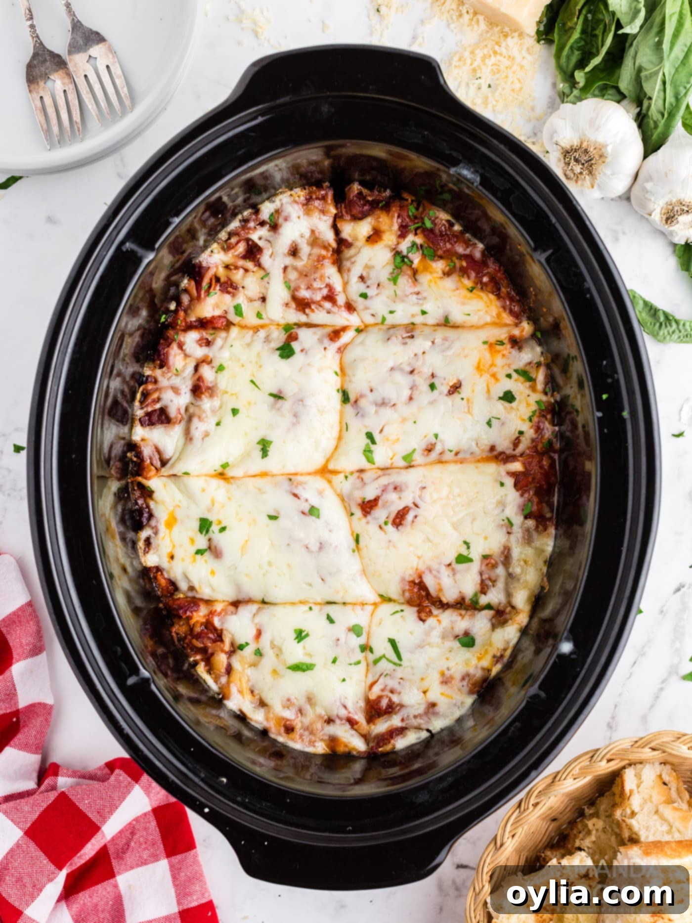 Set It and Forget It Lasagna 11 The finished crockpot lasagna, with melted and bubbly mozzarella cheese on top, ready to be served.