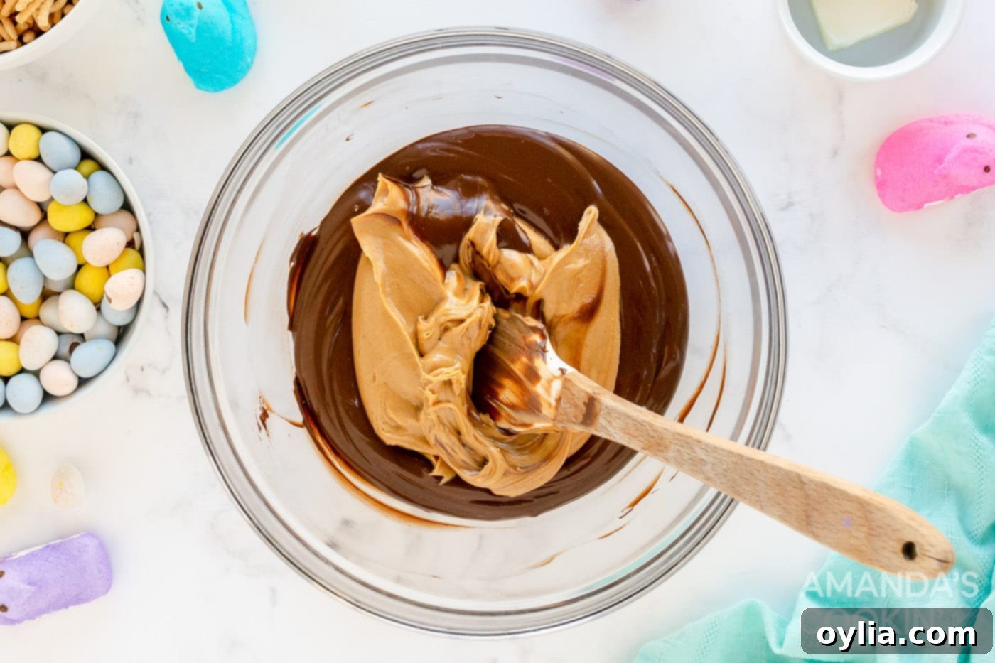 Peanut butter being mixed in with melted chocolate