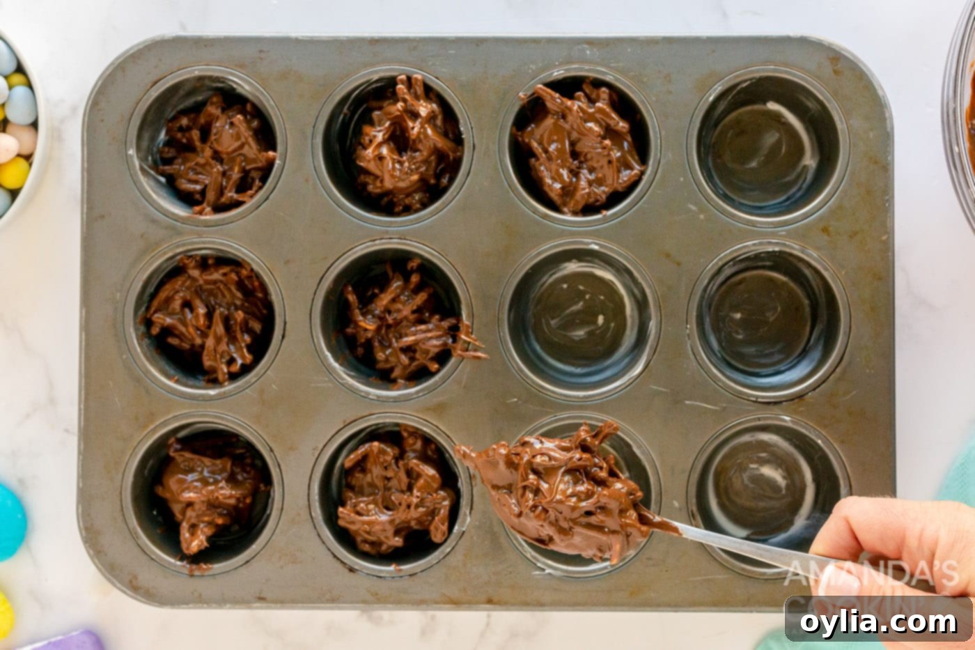Spoon the bird nest cookie mixture into a muffin pan.