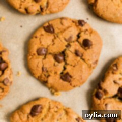 A stack of golden brown Air Fryer Chocolate Chip Cookies, soft on the inside and crispy on the outside.