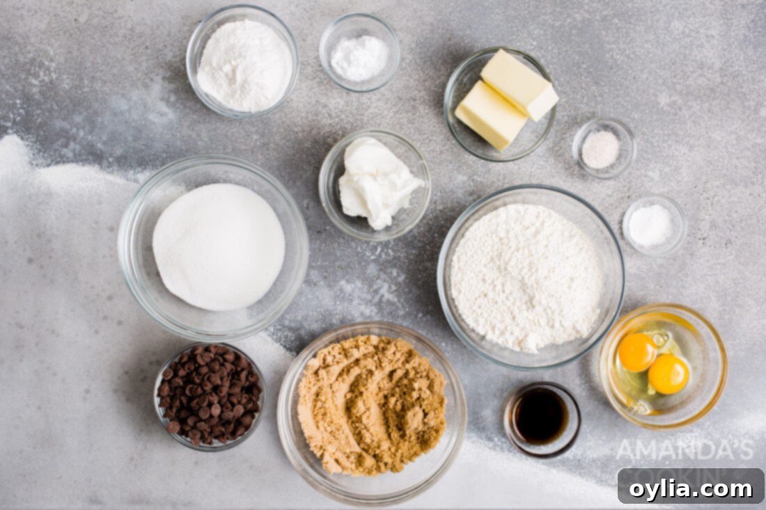 A flat lay photograph displaying all the ingredients for air fryer chocolate chip cookies, neatly arranged.