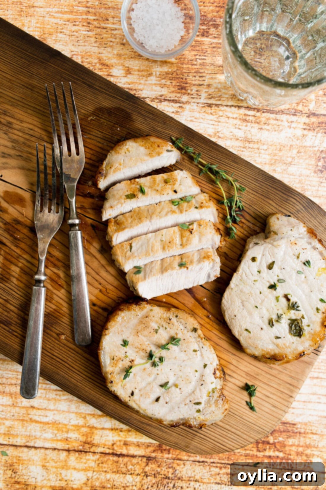 Crispy Air Fryer Pork Chops 2 pork chops on a cutting board
