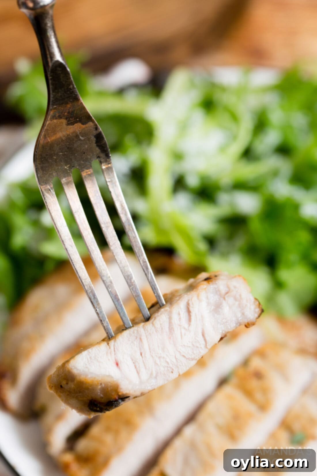 Crispy Air Fryer Pork Chops 9 sliced pork chop on a fork