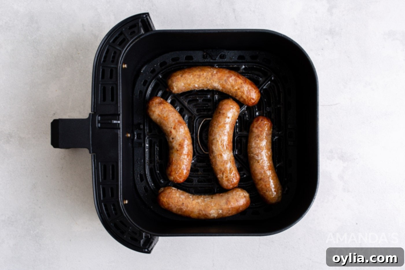 cooked bratwurst in an air fryer