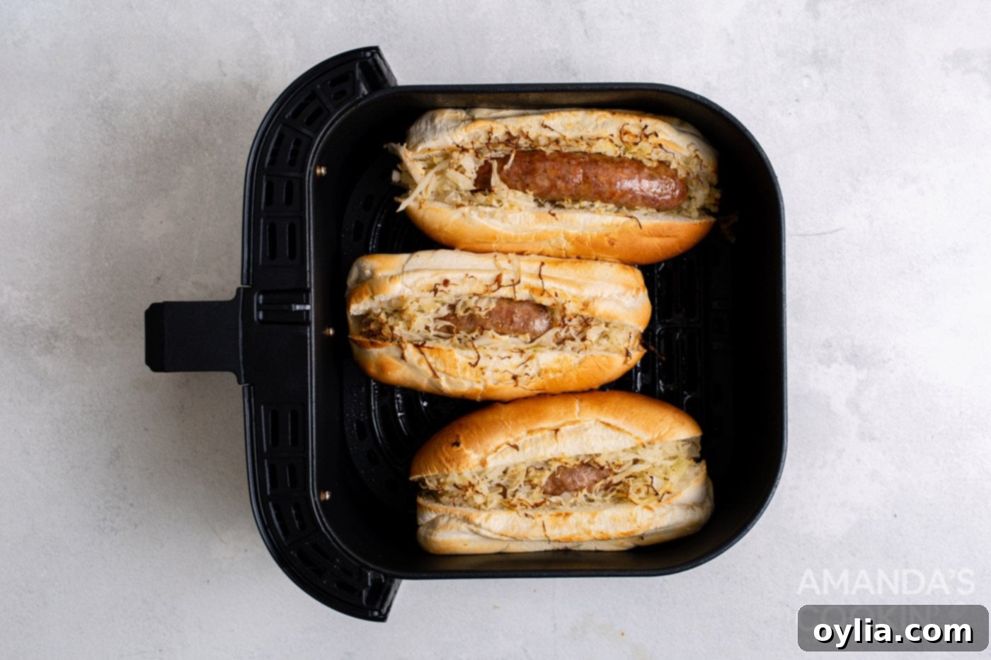 Cooked bratwurst in a bun