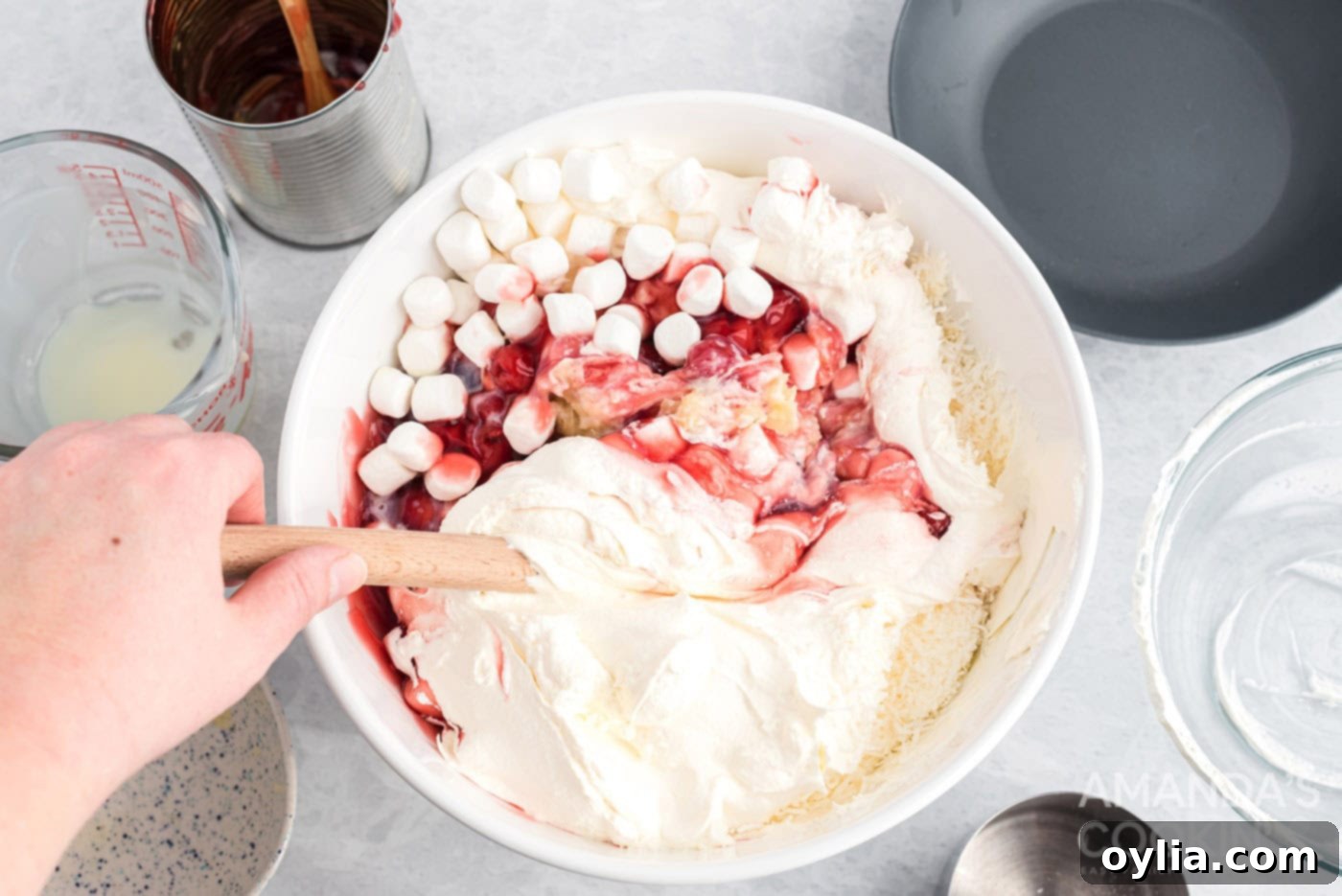 Mixing all ingredients for cherry fluff in a large bowl until well combined.