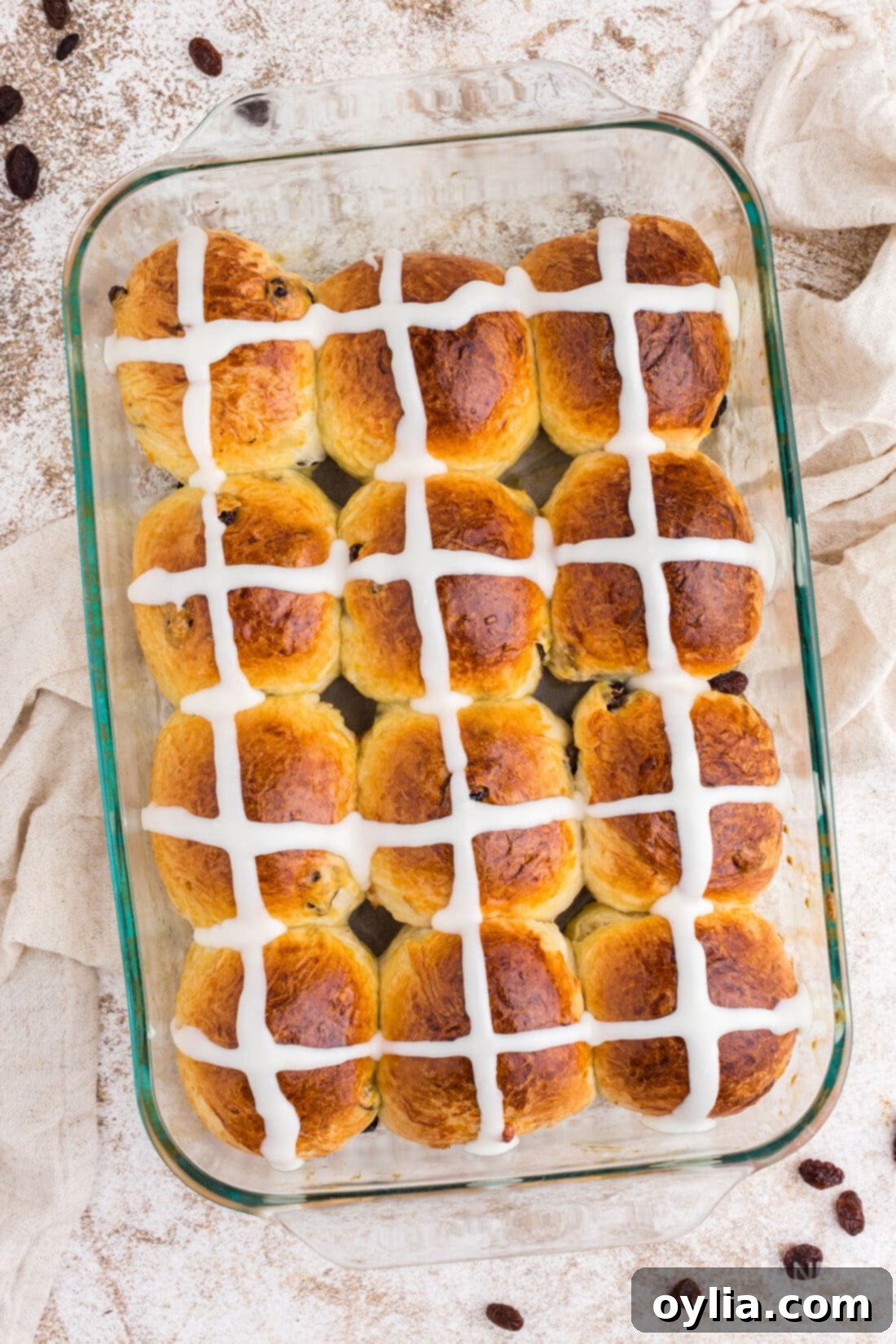 Hot Cross Buns baked in a glass pan, ready to be served