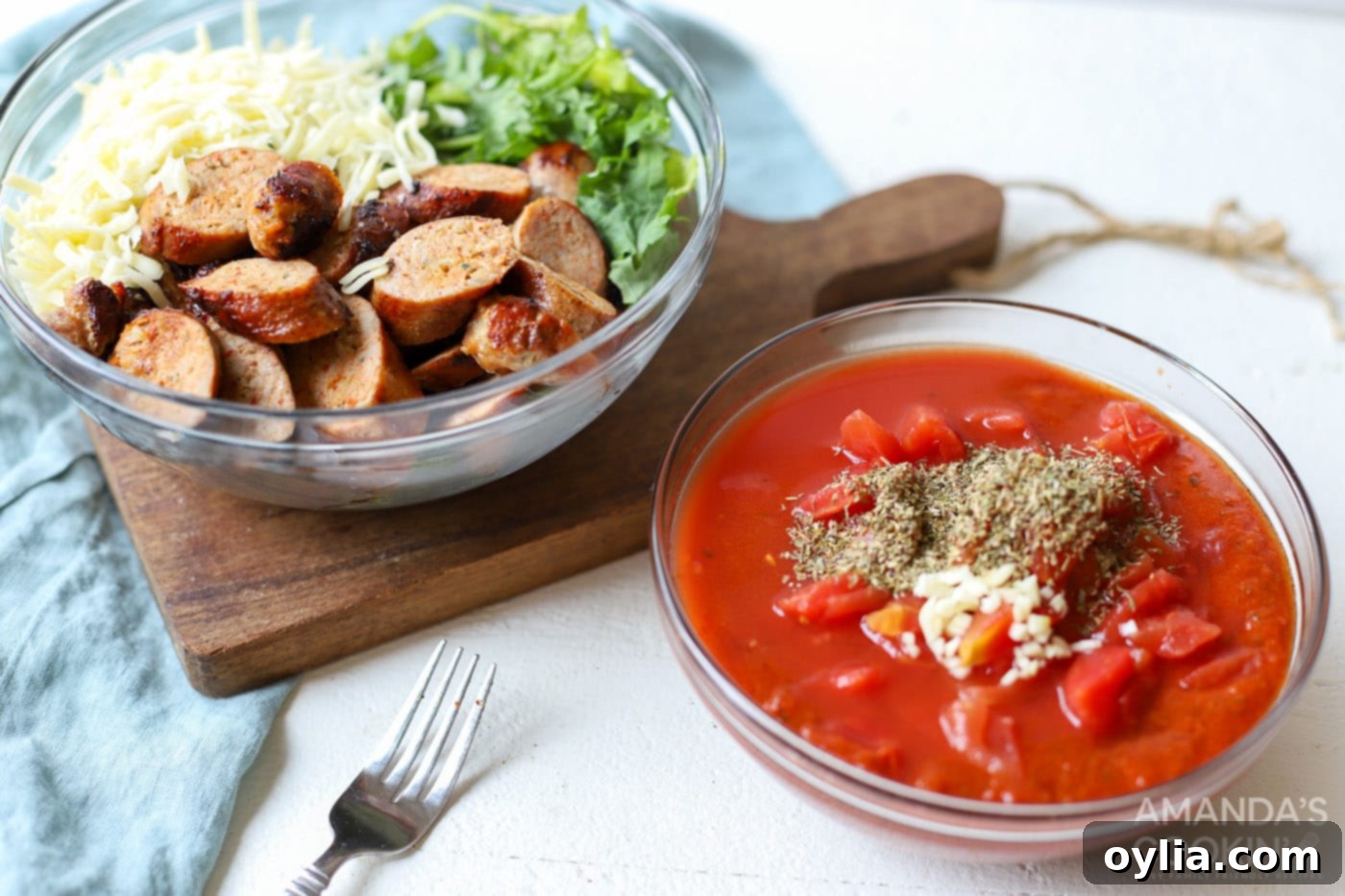 a bowl with sauce ingredients and one with sausage, cheese, and spinach.