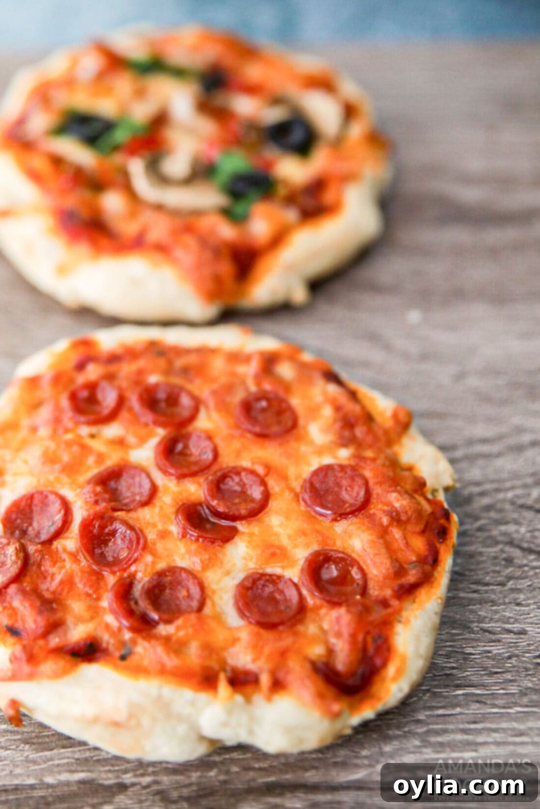 The Perfect Air Fryer Pizza 2 pizza made in the air fryer, golden crust and melted cheese