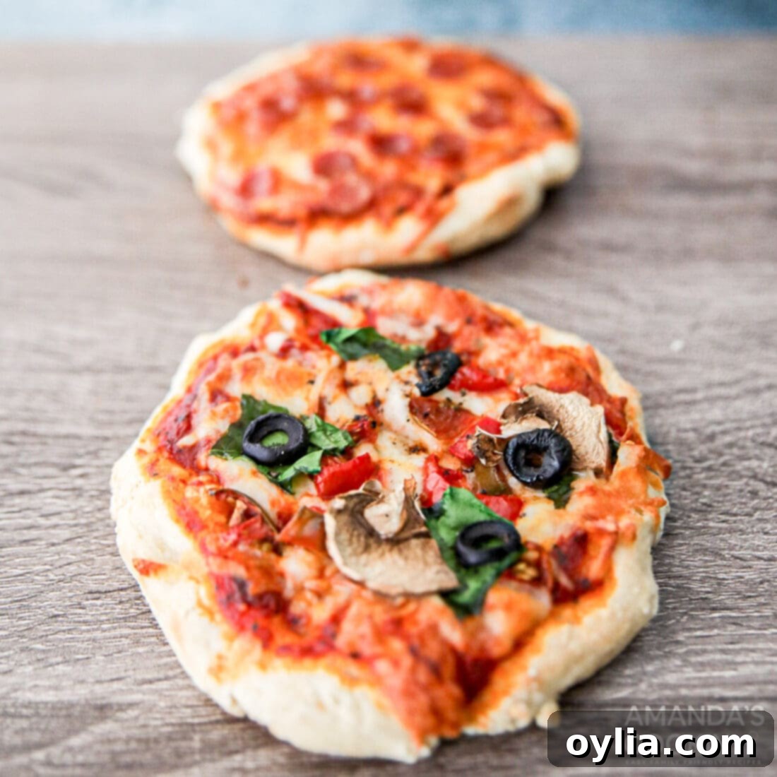 The Perfect Air Fryer Pizza 9 Two freshly cooked Air Fryer Pizzas, golden and delicious