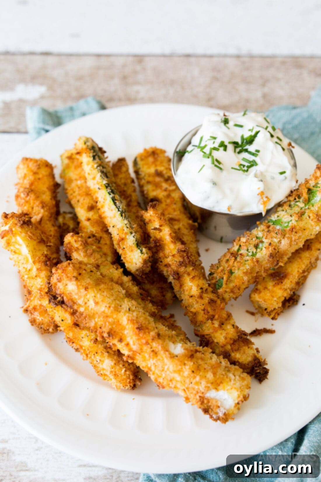 air fryer zucchini fries and sauce on a plate