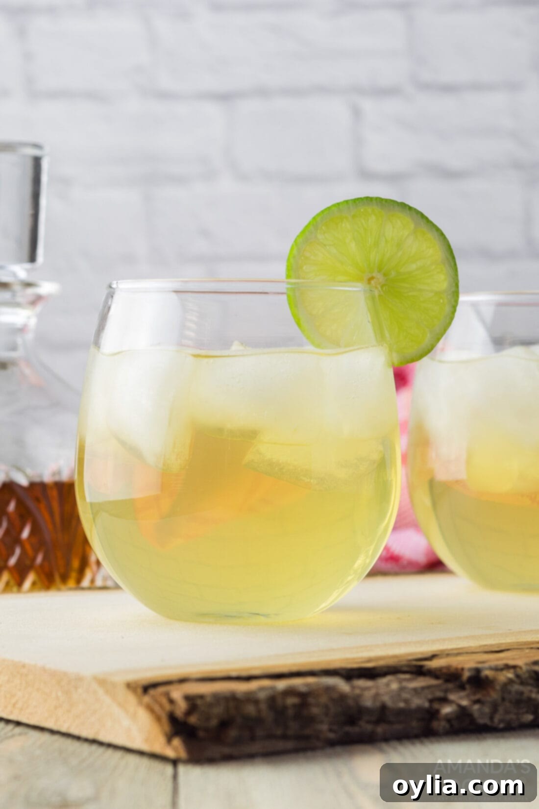 Zesty Spirit 3 Close-up of Spiked Limeade in a glass with ice and a lime wedge
