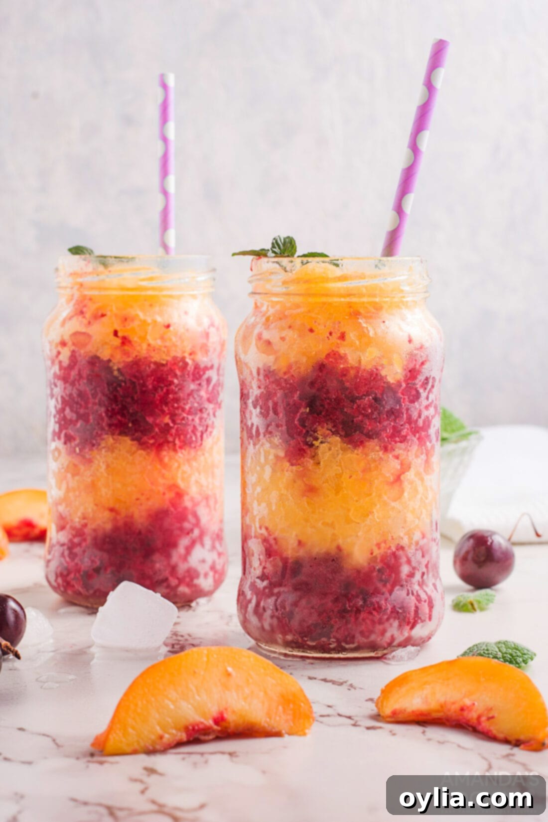 layered cherry peach slushies in jars