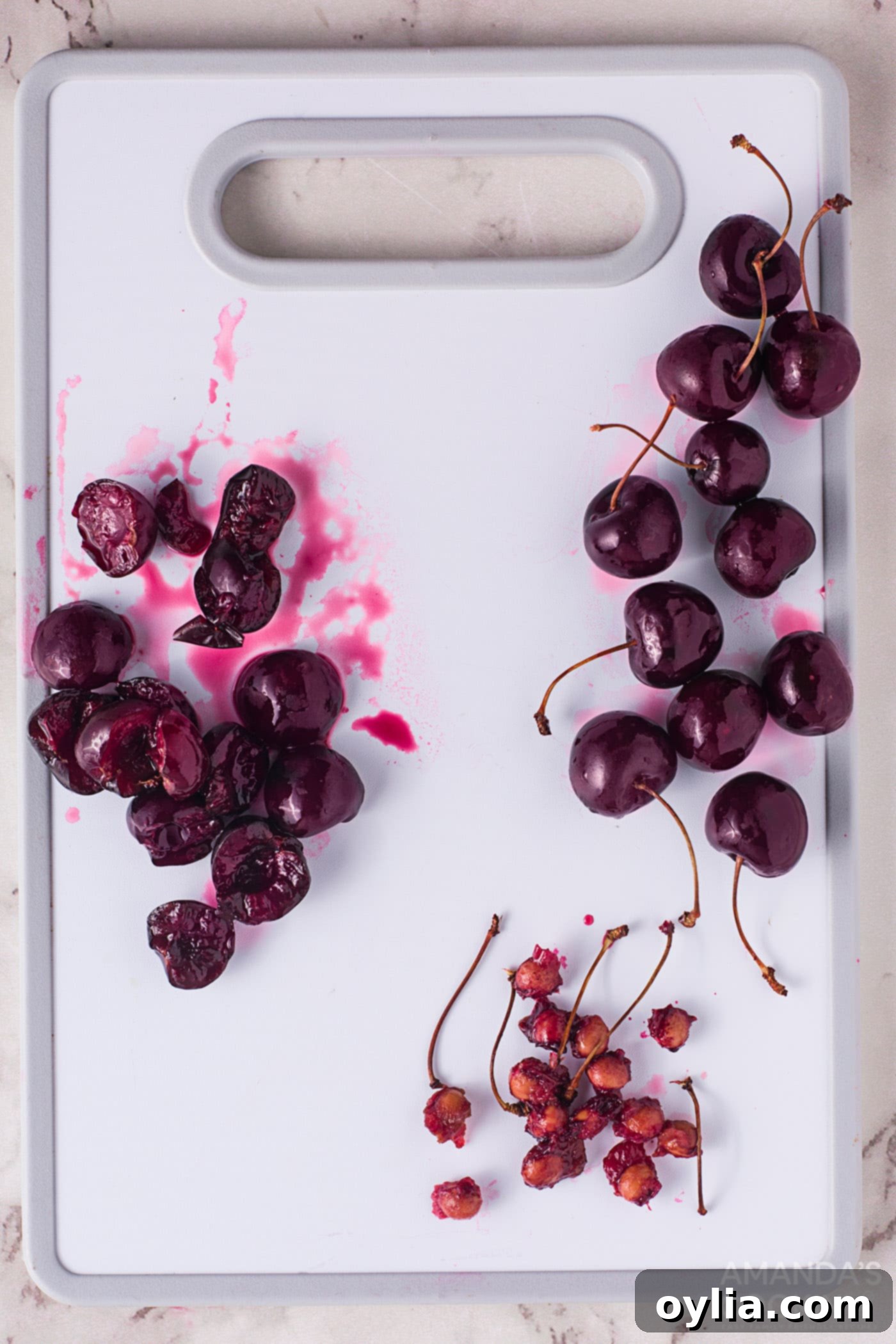 cherries with pits being removed