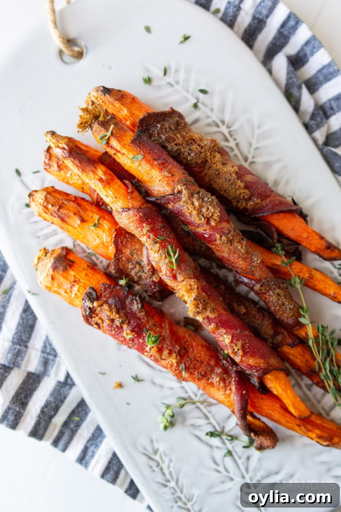 Sweet and Savory Air Fryer Bacon Wrapped Carrots 2 plate of candied bacon wrapped carrots