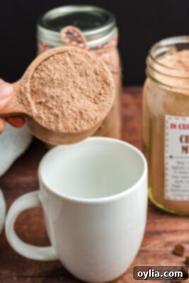 adding cake mix to a mug