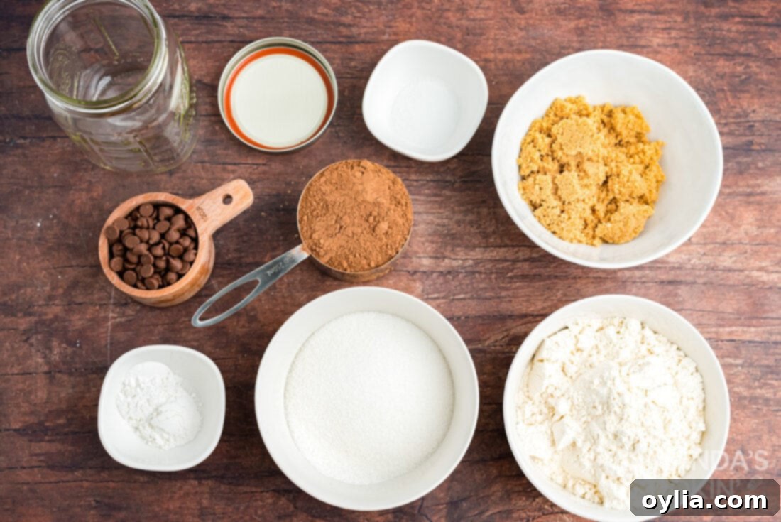 Ingredients for chocolate mug cake mix being layered in a jar.
