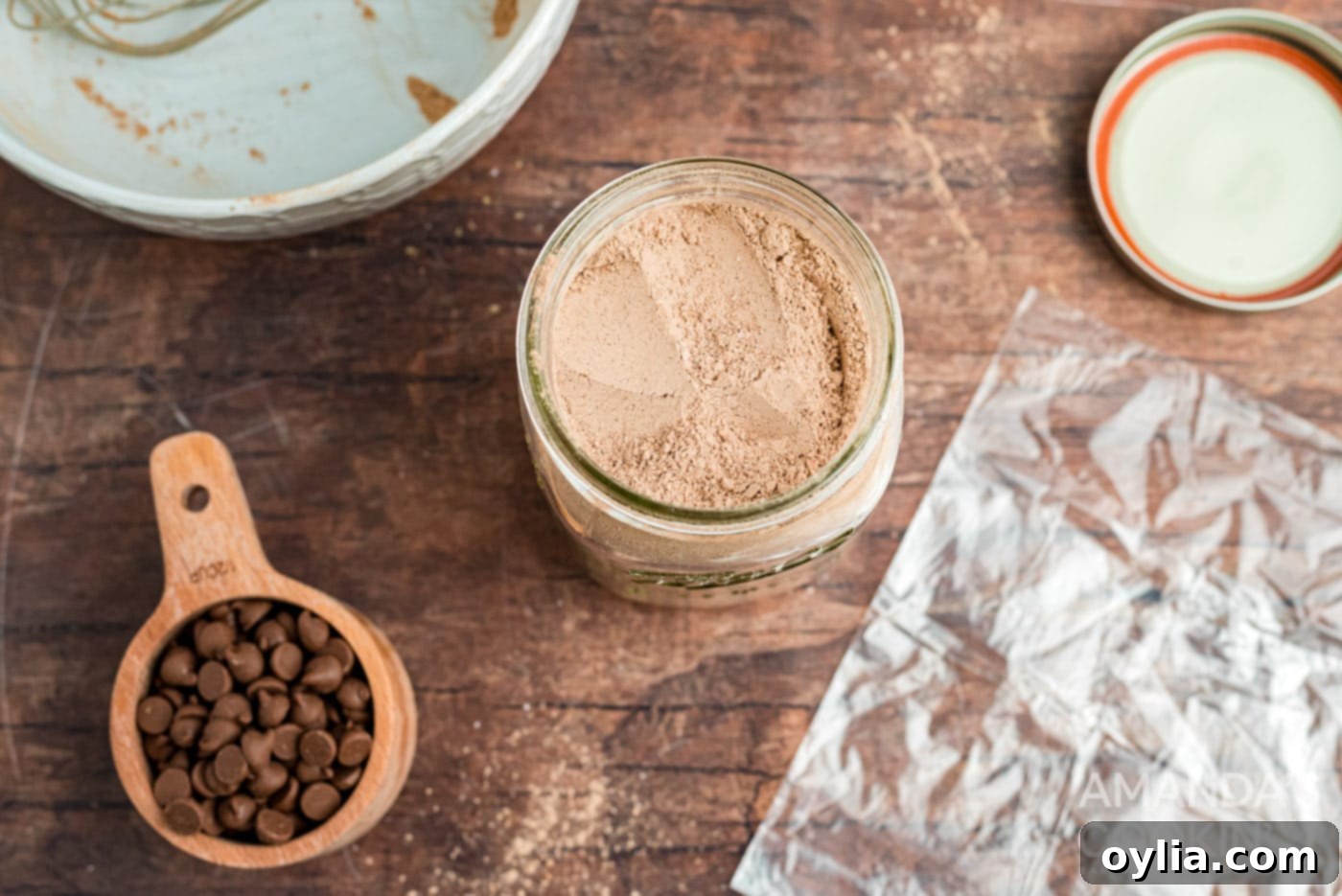 Dry ingredients for mug cake mix placed into a mason jar.