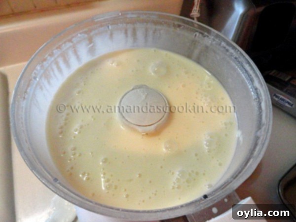 A photo of the ingredients for lemonade cheesecake in a food processor. 