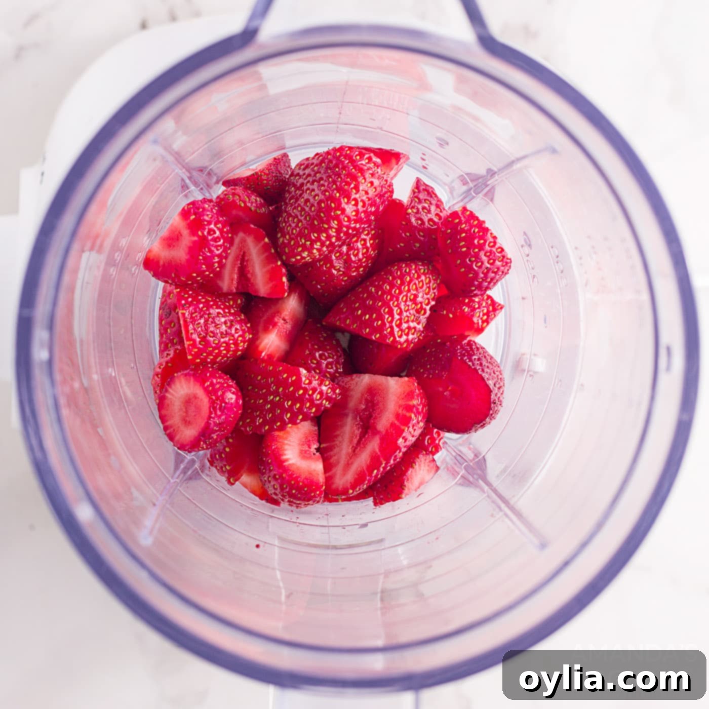 strawberries in a blender, ready for blending
