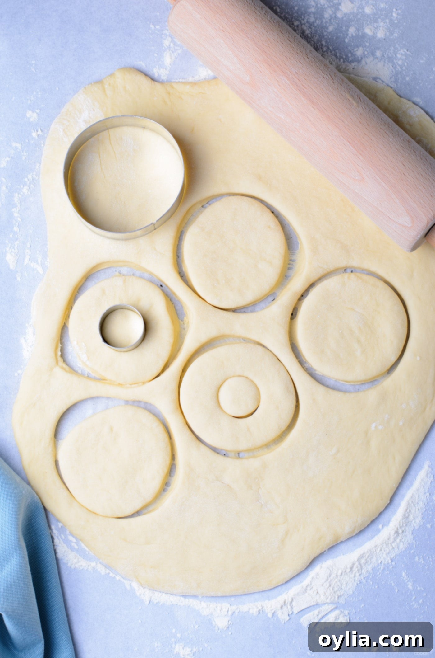 cutting donuts out of dough
