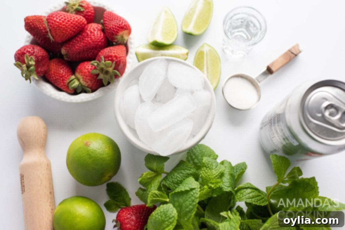 A collection of fresh ingredients for a Strawberry Mojito: whole strawberries, mint leaves, limes, and sugar.