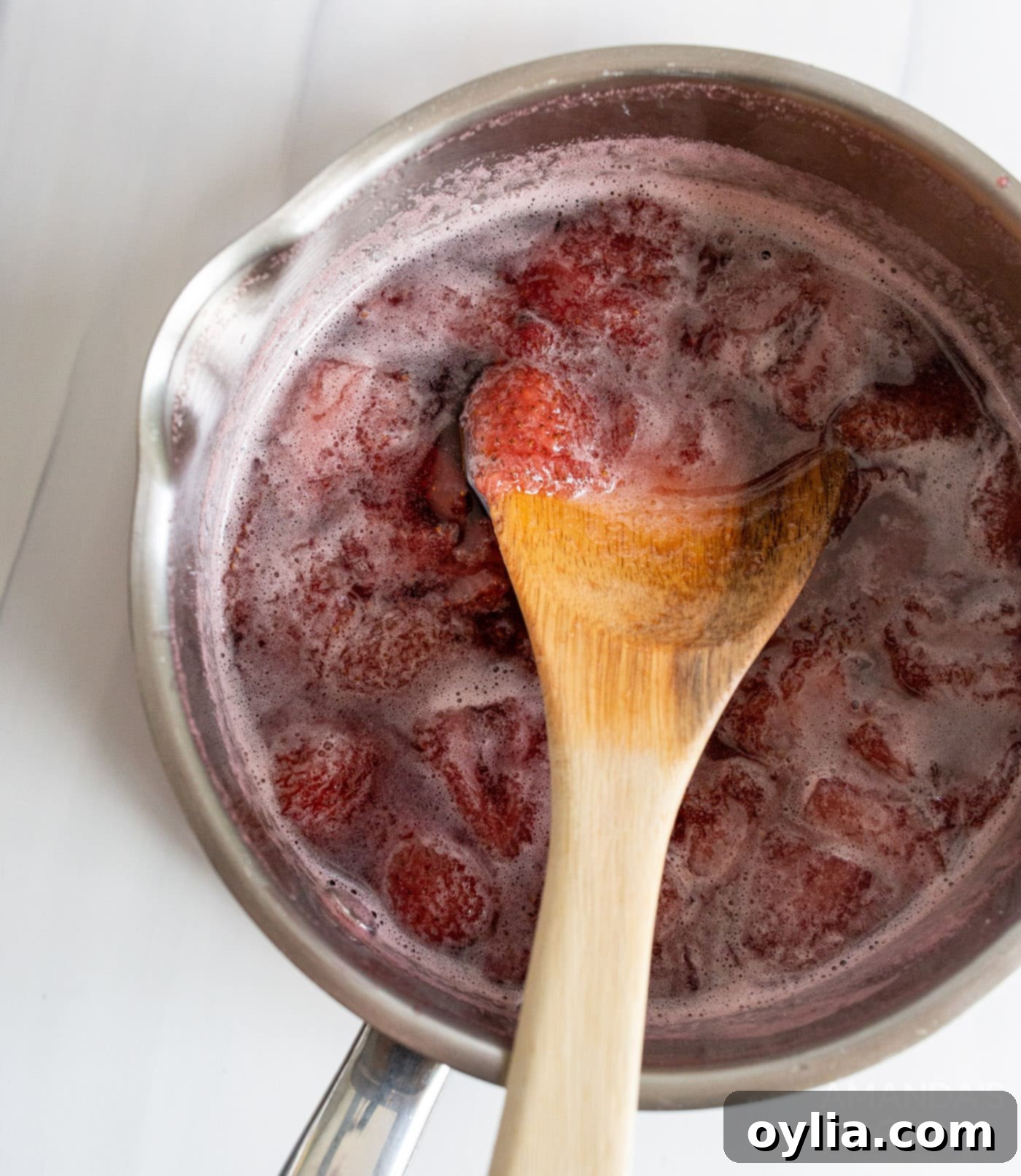 strawberry simple syrup in a saucepan