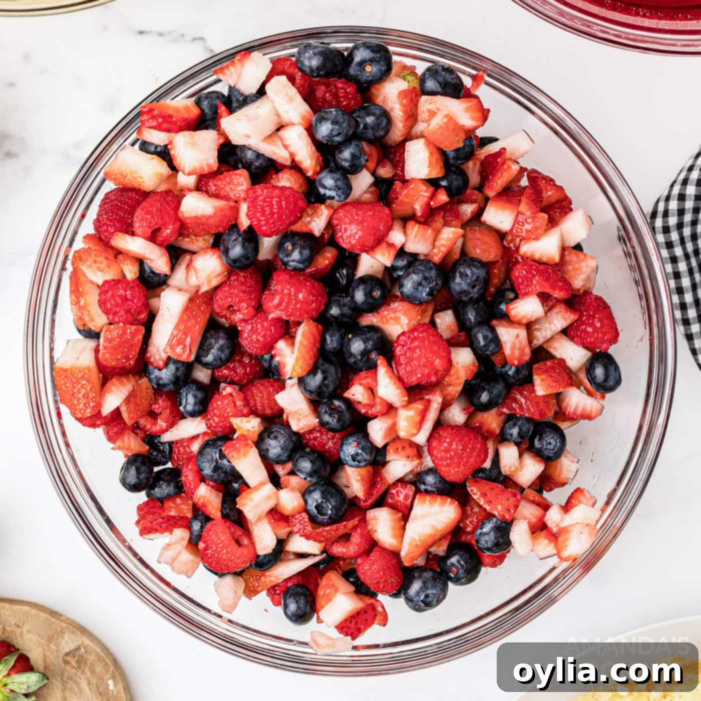 chopped fruit in a bowl, ready for trifle assembly