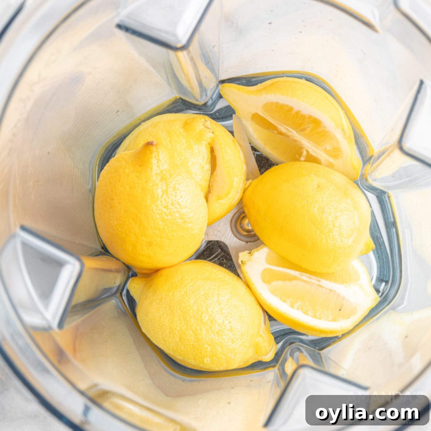 halved lemons in a blender