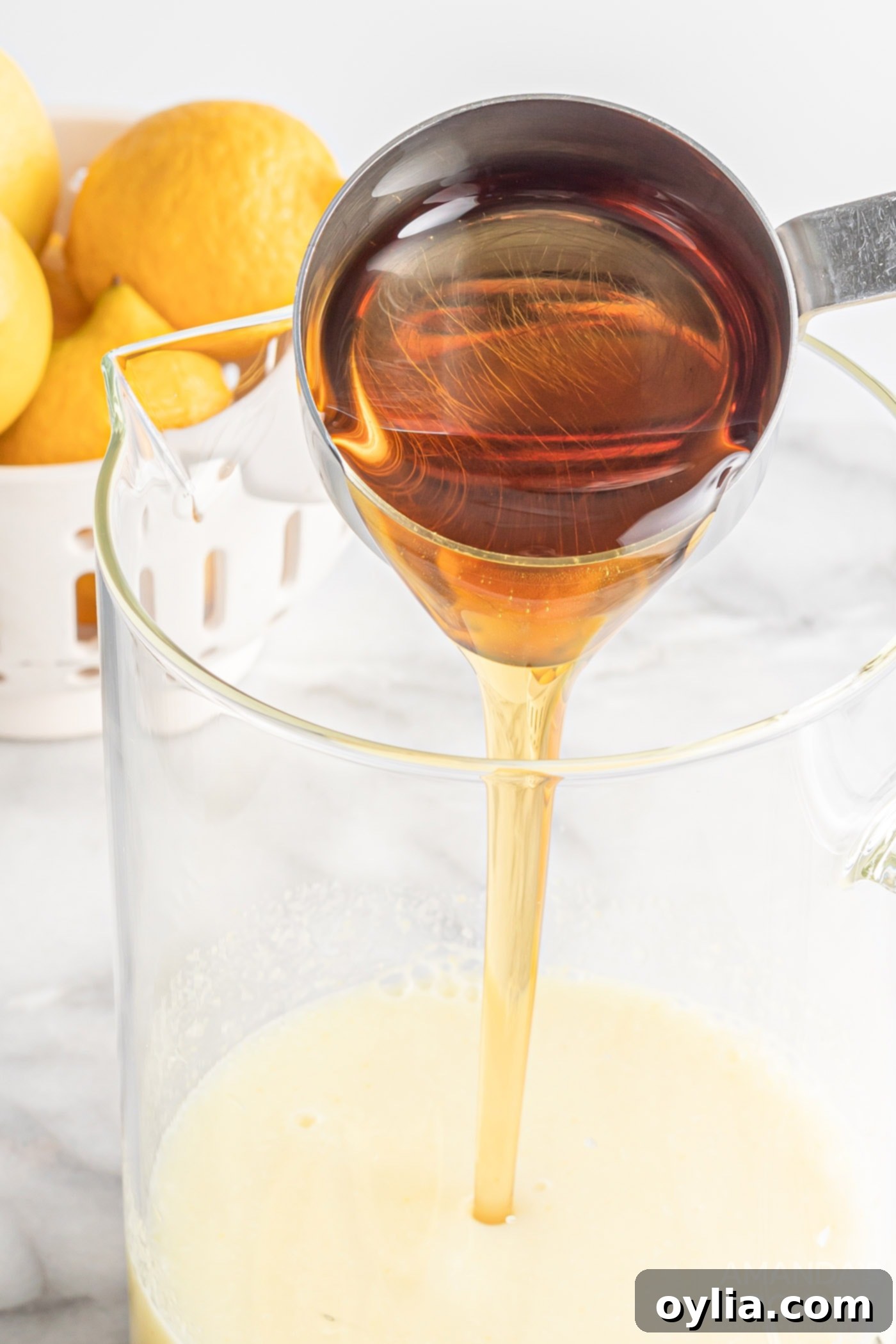 measuring cup pouring agave nectar