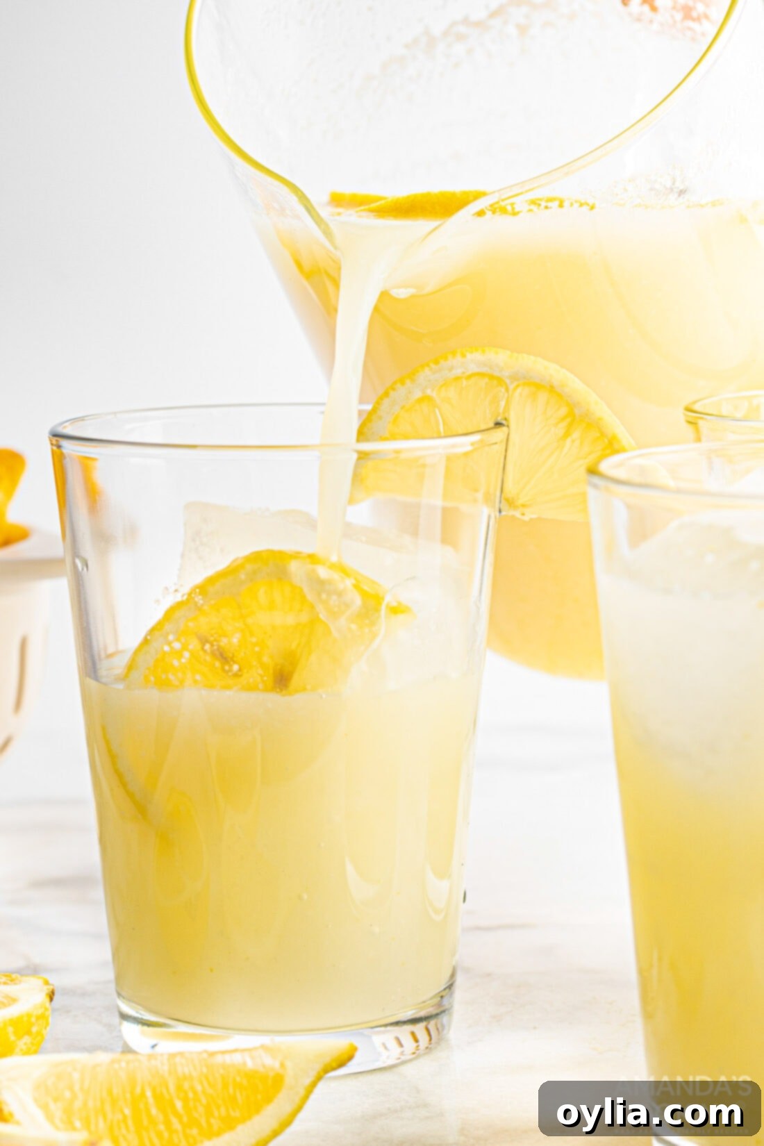 pouring a glass of Frozen Lemonade