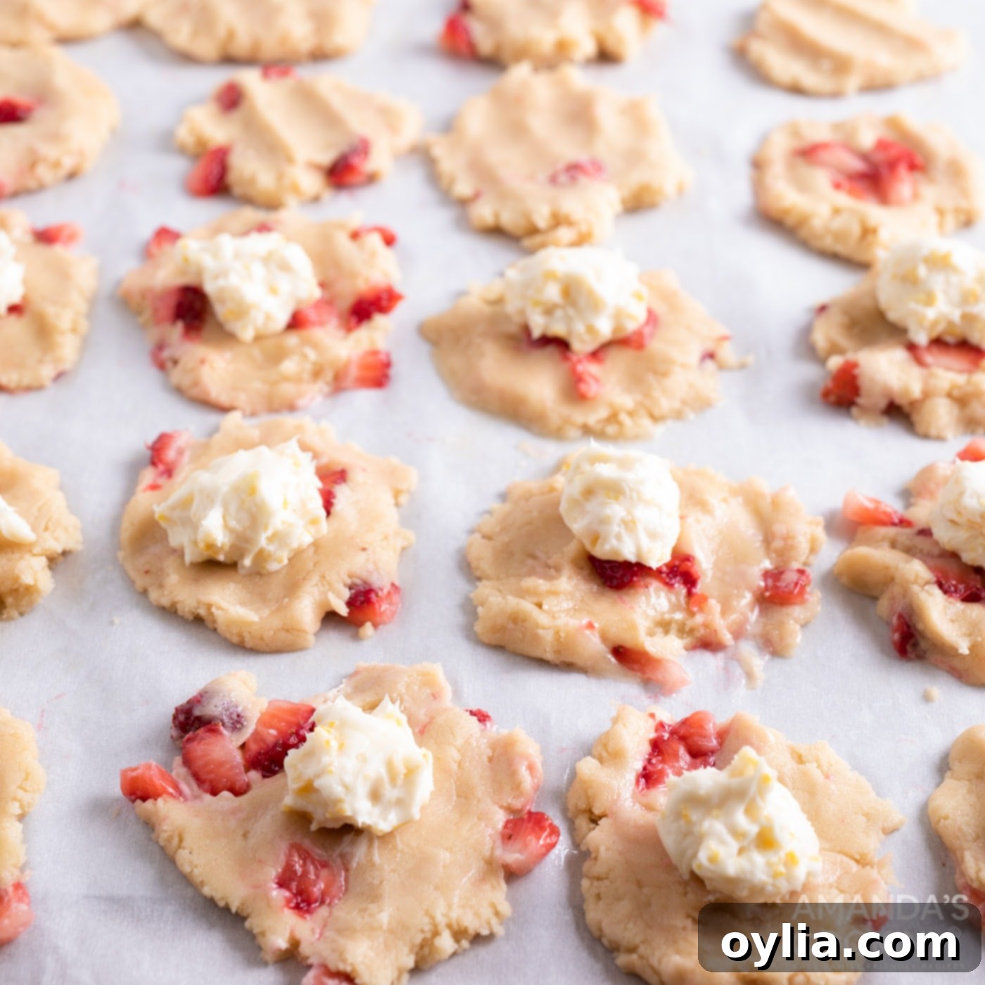 cream cheese balls on top of cookie dough