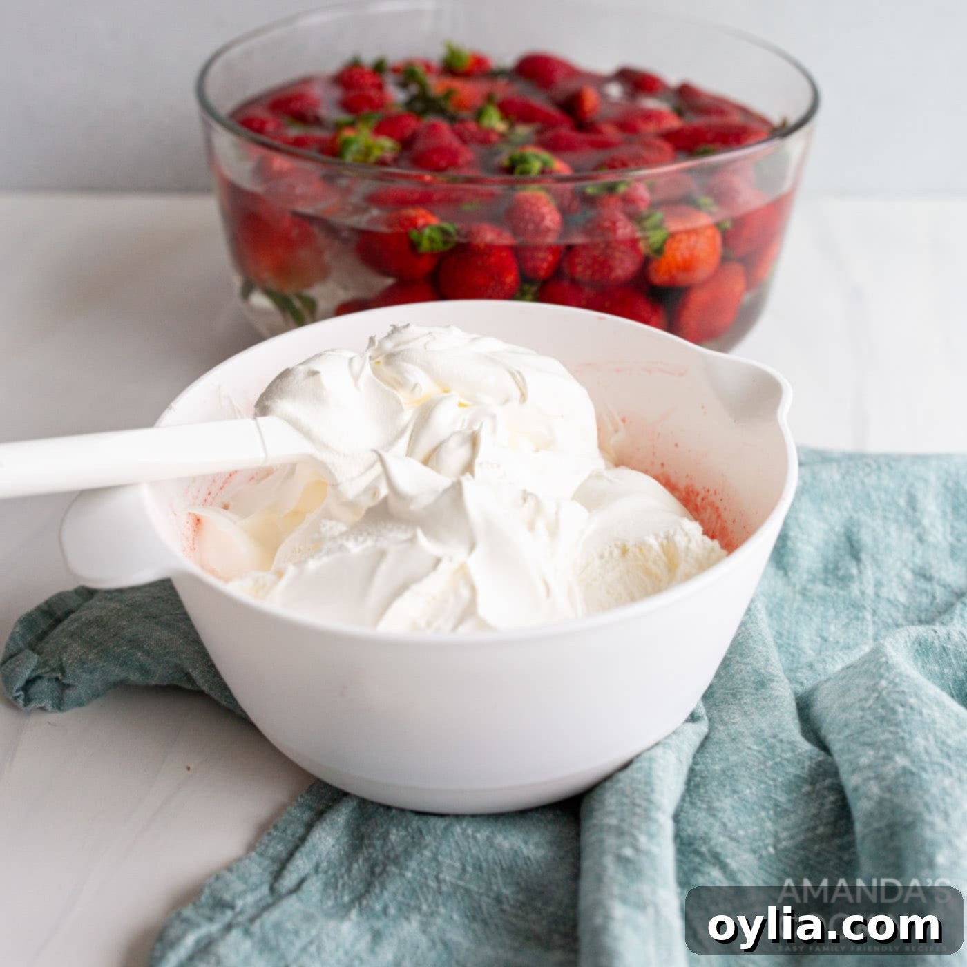 folding cool whip into strawberry jello mixture